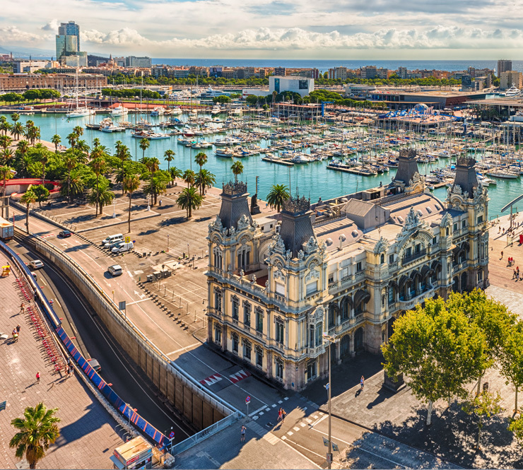 Aerial view of the Port Authority- Admiral Historic Authority building with the Port Vell harbor in the background in Barcelona, Spain.