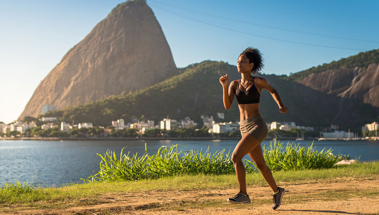 Woman running on a dirt path in Rio de Janeiro, Brazil.