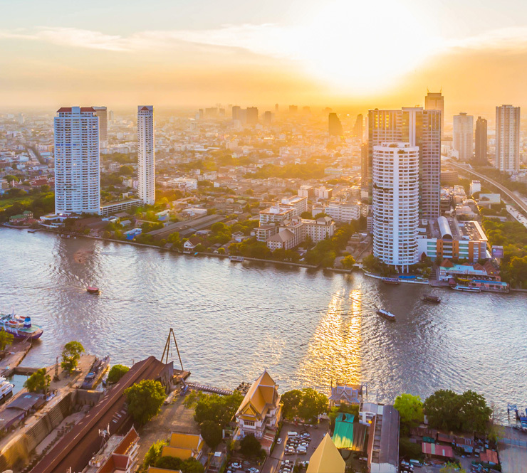 An aerial shot of Chao Phraya River and downtown Bangkok Thailand.