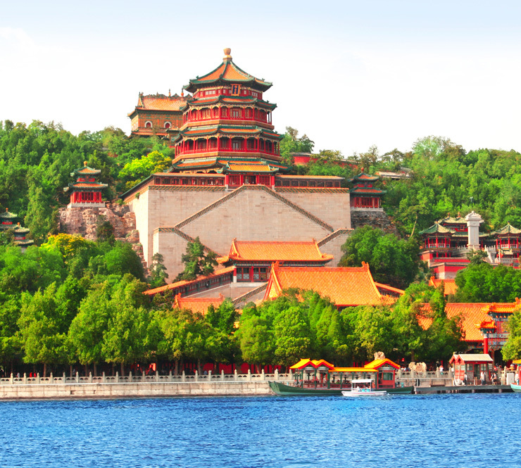 View of Beijing's Summer Palace with lush green trees around the buildings in Beijing China. 