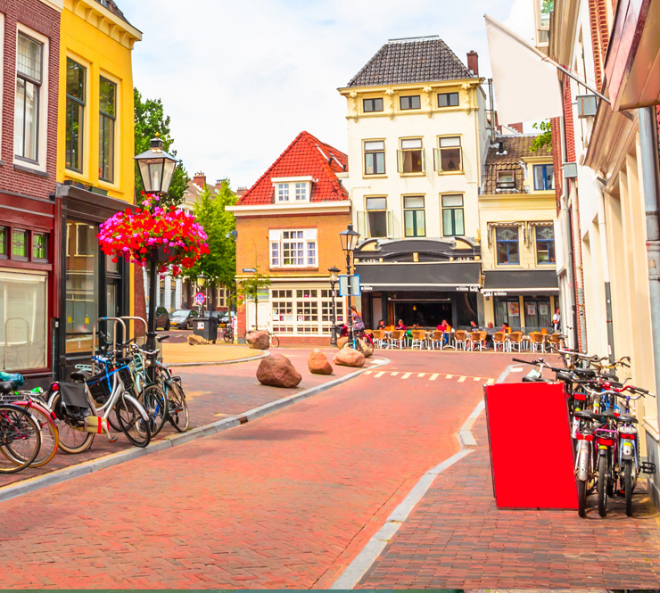 Landscape shot of a traditional old street and colorful buildings in Utrecht, Netherlands. Utrecht, Netherlands