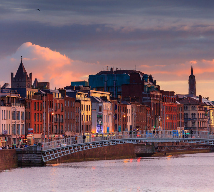 The Half Penny Bridge at sunset in Dublin, Ireland
