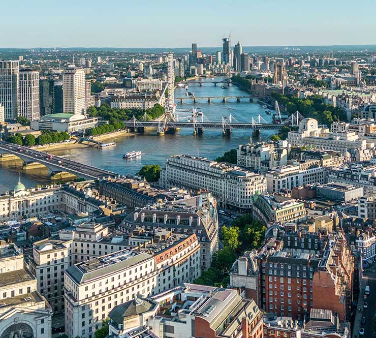 Aerial view of historic London rooftops and skyline and the River Thames