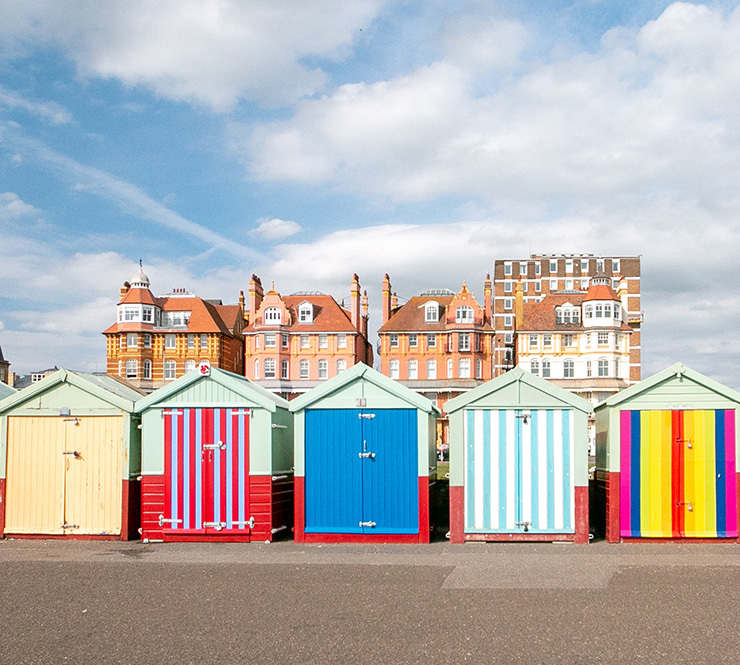 Colorful row of beach huts on in Brighton, Hove, England
