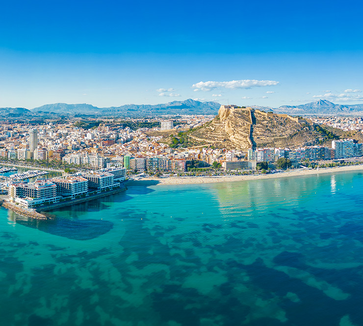 Aerial panoramic view of Alicante, with the Postiguet Beach, port of Alicante, and the Castle of Santa Barbara