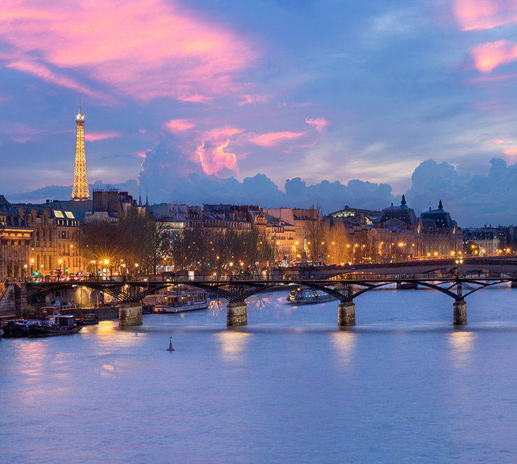 Sunset cityscape view of the Pont des Arts, Paris