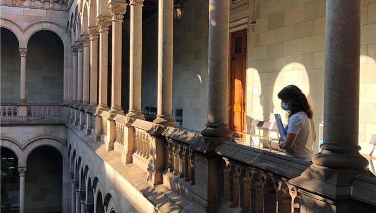 A student overlooks a balcony at the Barcelona Study Center.