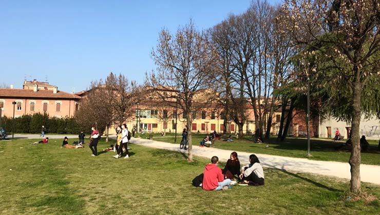 Students sit in a park outside the Bologna Study Center
