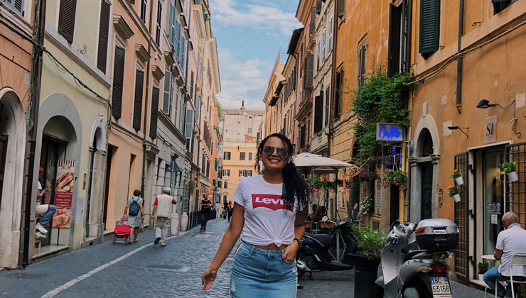 Jennifer Coto of UC Riverside smiles as she walks down a street near the hostel she stayed at in Rome, Italy.