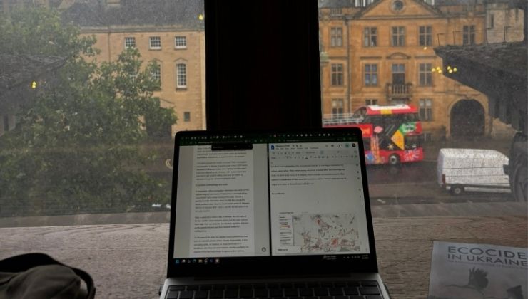 Anya's laptop with research paper in progress from the top floor of the Taylor Institution Library on a rainy day