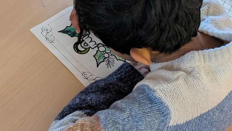 A non-verbal child engaged in coloring