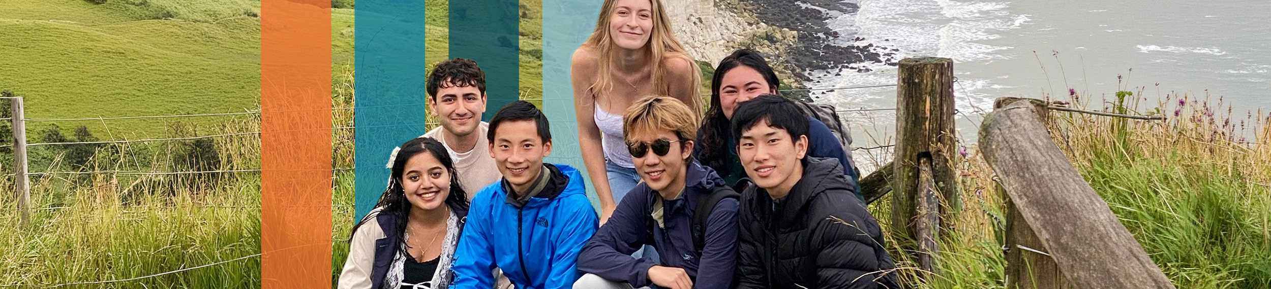 Group of students at a scenic view overlooking white chalk cliffs and ocean