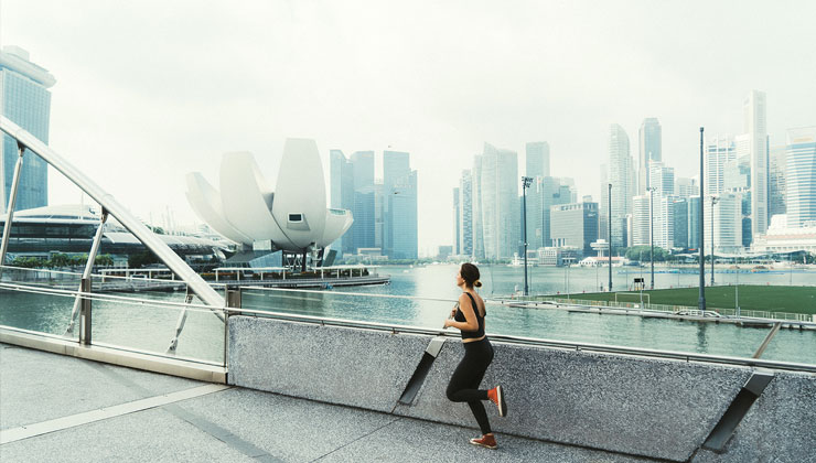 Student jogs near Marina Bay in Singapore.