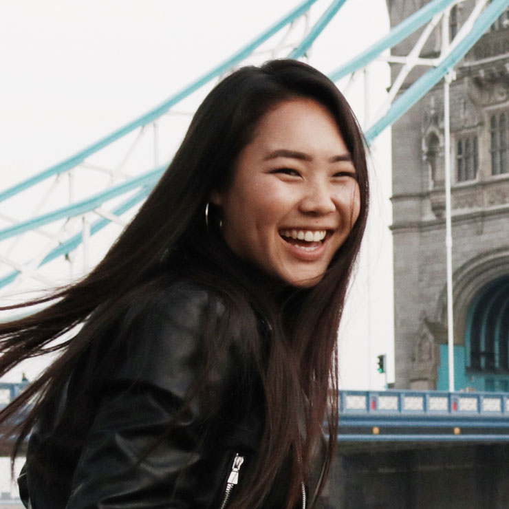 Woman smiling on a windy day in London.