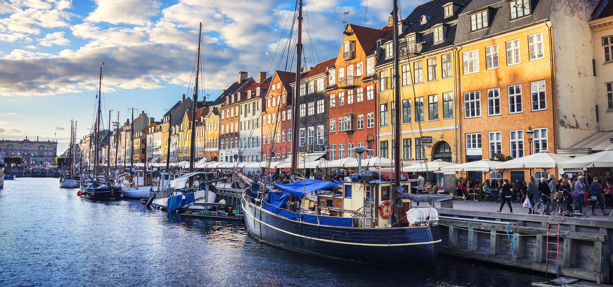 Colorful houses and boats at Nyhavn in Copenhagen, Denmark.