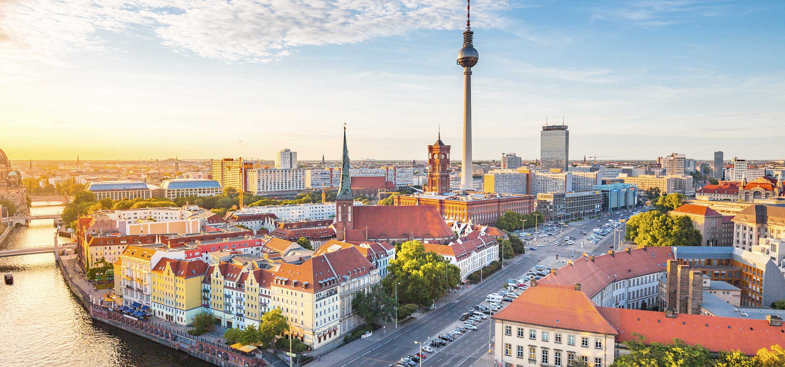 Sunset view of the Berlin skyline, featuring the famous TV tower and Spree