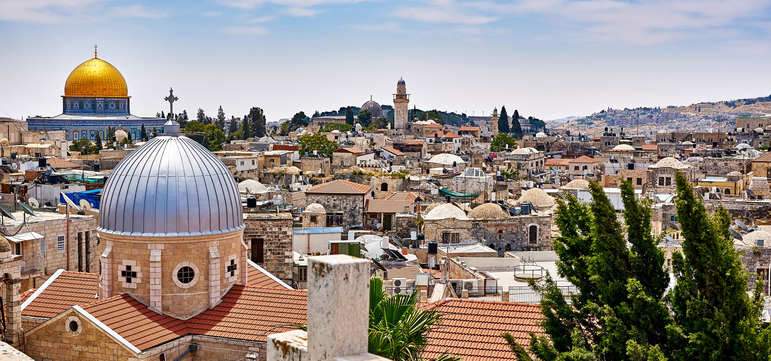 Aerial view of Jerusalem, Israel, with the golden Dome of the Rock on the Temple Mount in the background. 