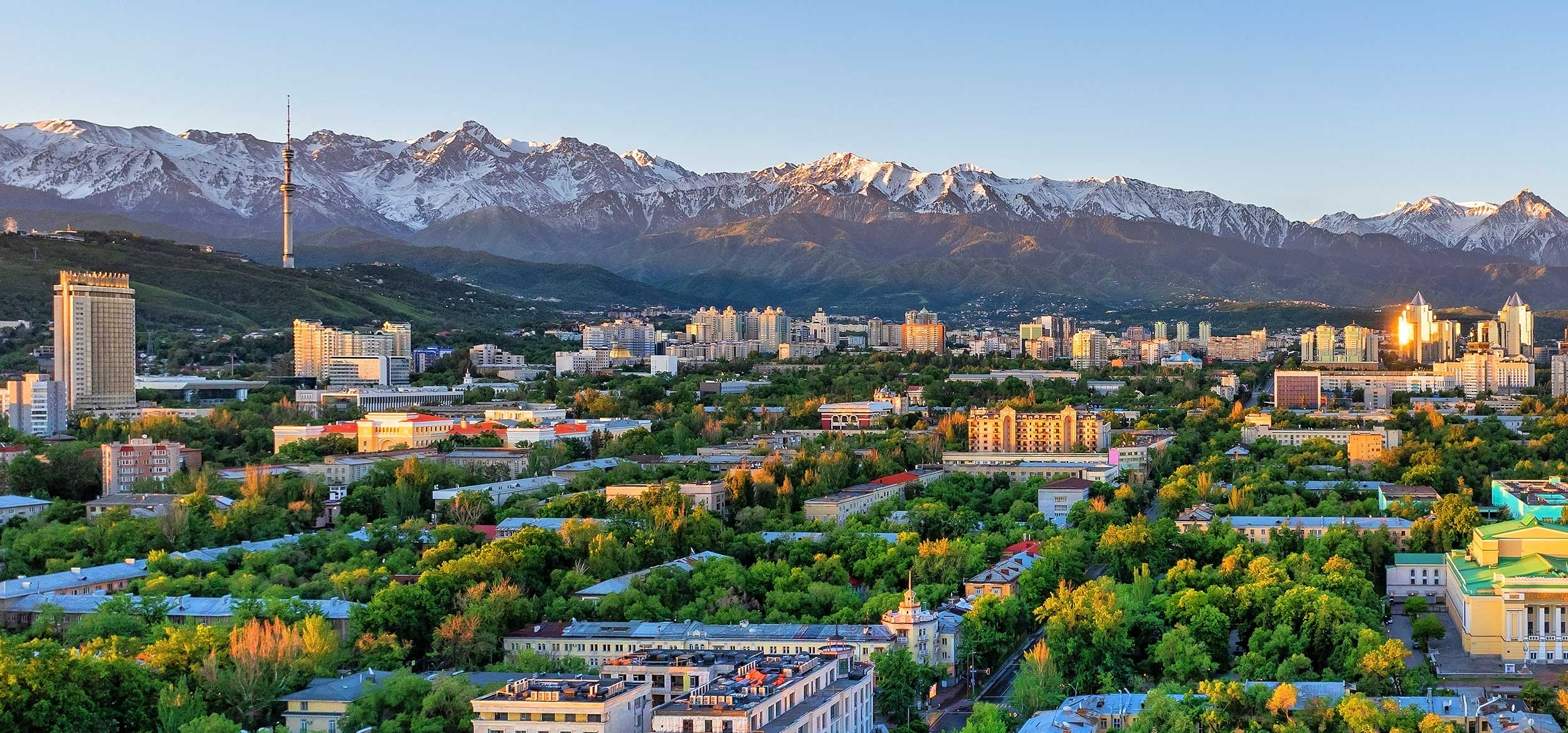 City of Almaty, Kazahkstan at sunrise on a spring morning against the backdrop of a Tien Shan mountain range