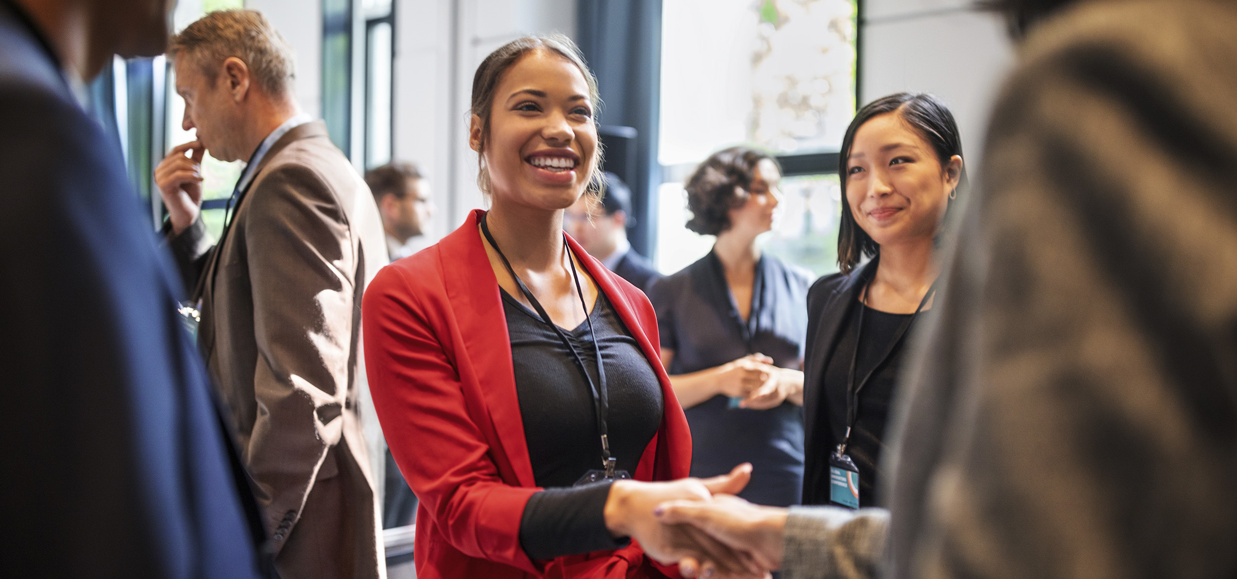 Two business professional handshake during an event in Berlin Germany. 