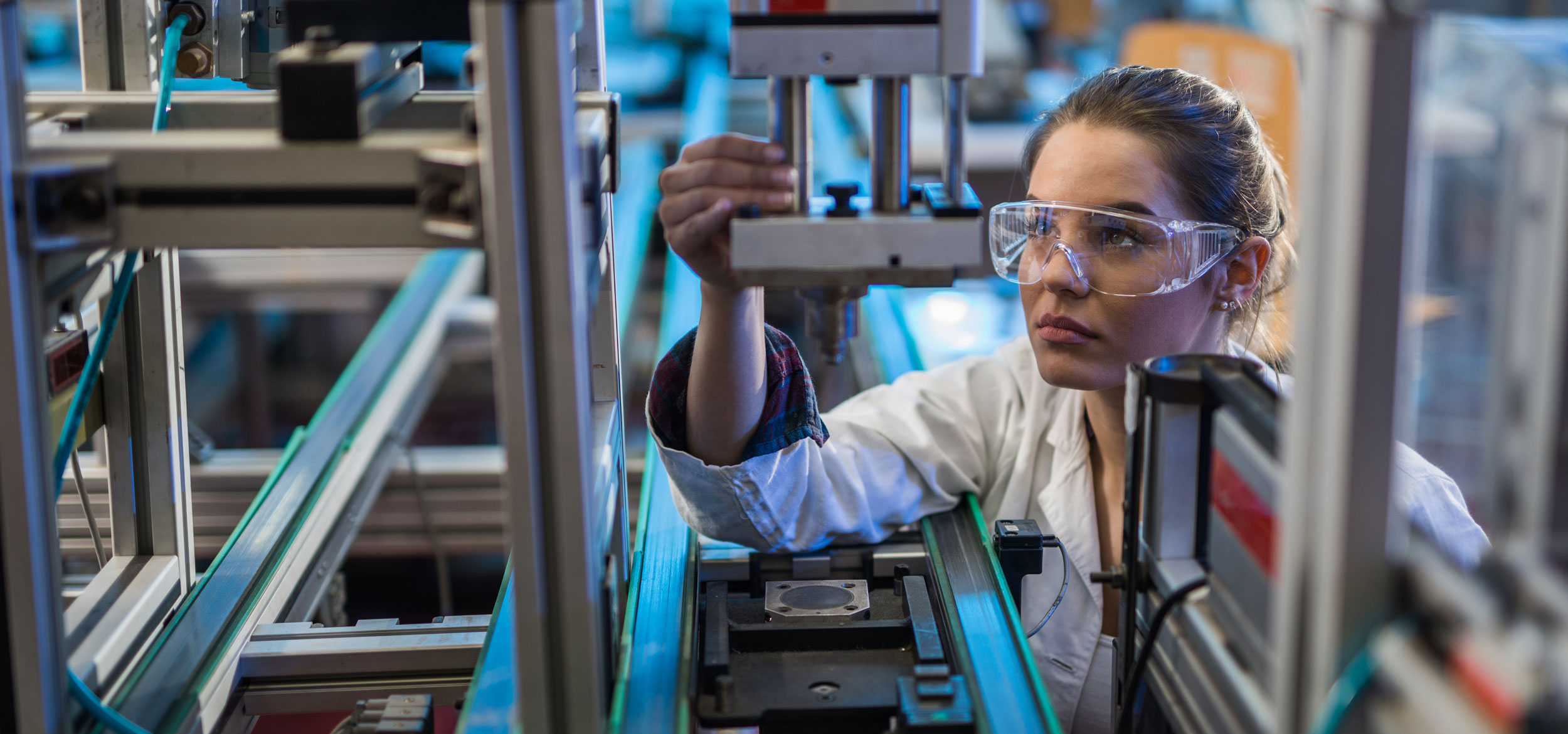 Student operating on a piece of lab equipment.