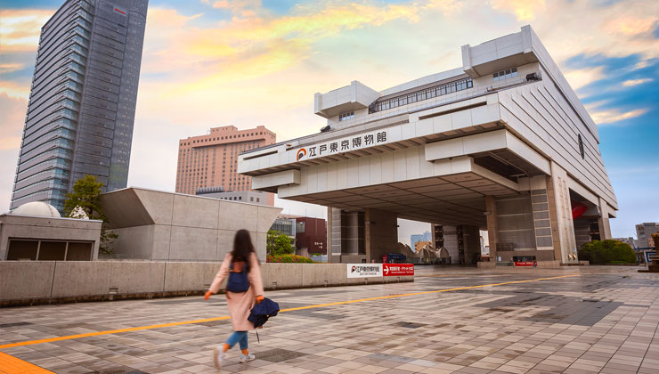 A student walks by the Edo Tokyo Museum in Tokyo, Japan.