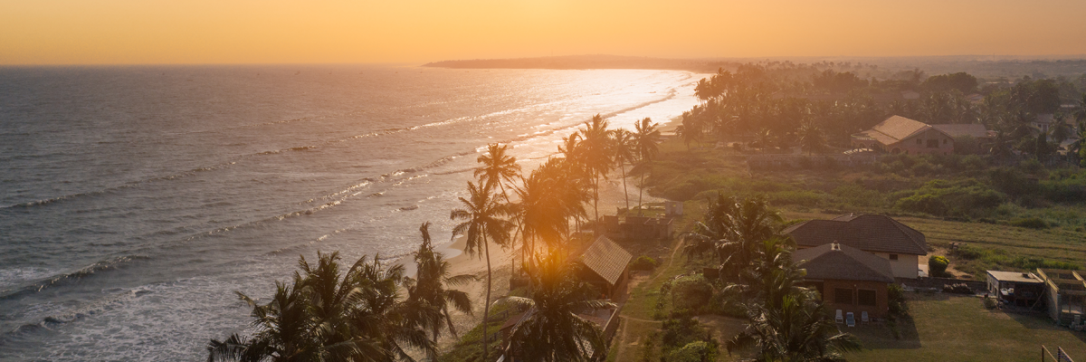 Aerial view of the shore and Gulf sea during sunset. 