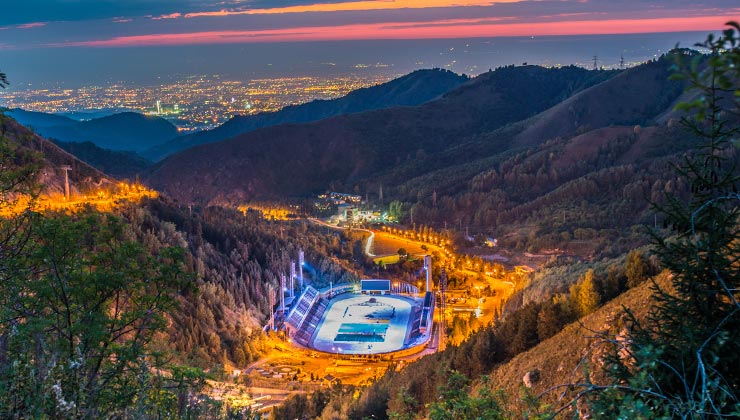  The Medeu rink lit up at night in the hills above the Almaty cityscape