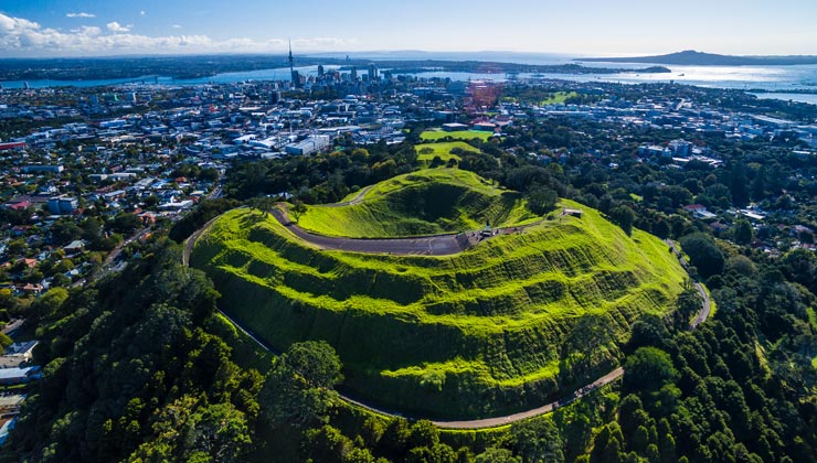 Aerial view of the Mount Eden volcanic cone with the city around it.