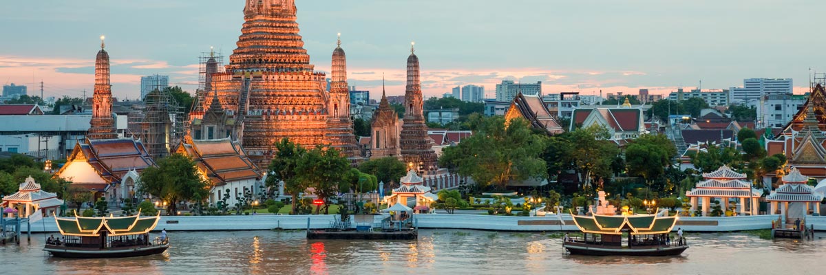 View of Wat Arun and the Chao Phraya River in Bangkok, Thailand.