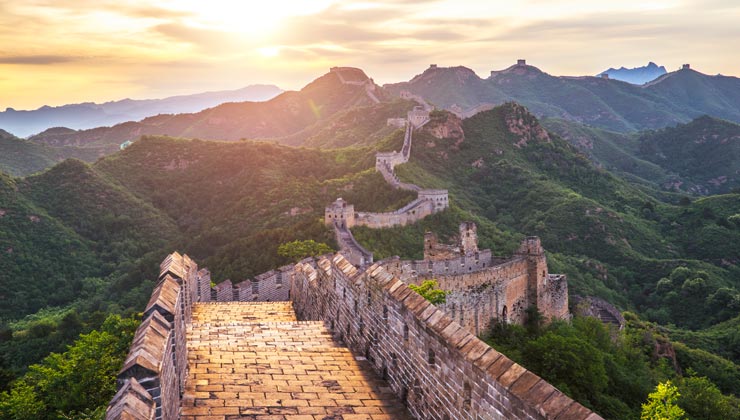 View of the Great Wall of China at sunrise.
