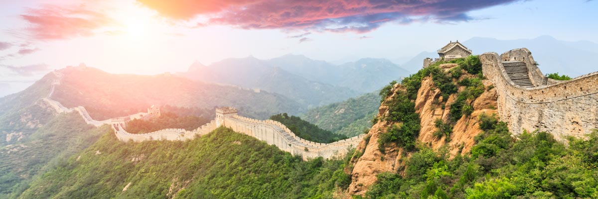 View of the Great Wall of China at sunset. 