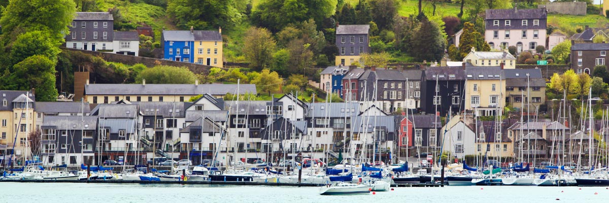 Boats and houses near the waterfront in Cork, Ireland. 