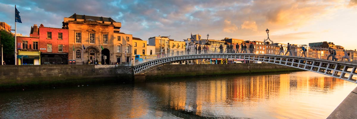 View of Ha'penny Bridge at sunset in Dublin, Ireland. 