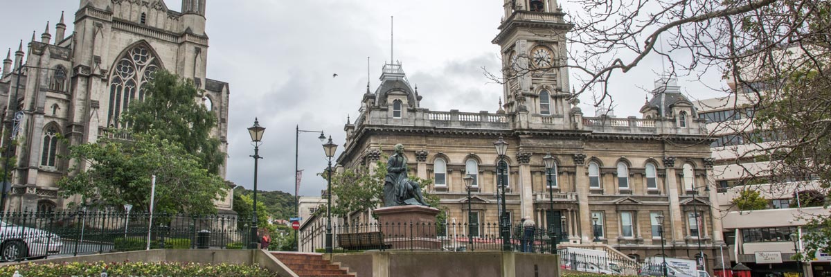 Robert Burns statue, Dunedin Town Hall and St. Paul's Cathedral in Dunedin New Zealand.