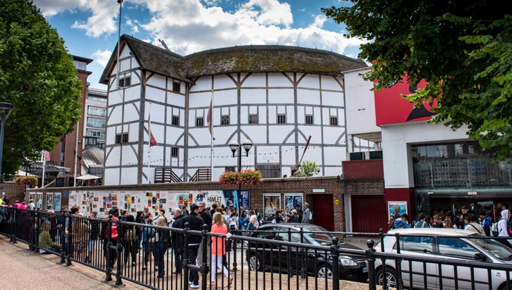 Pedestrians outside Shakespeare's Globe Theater in London, England. 