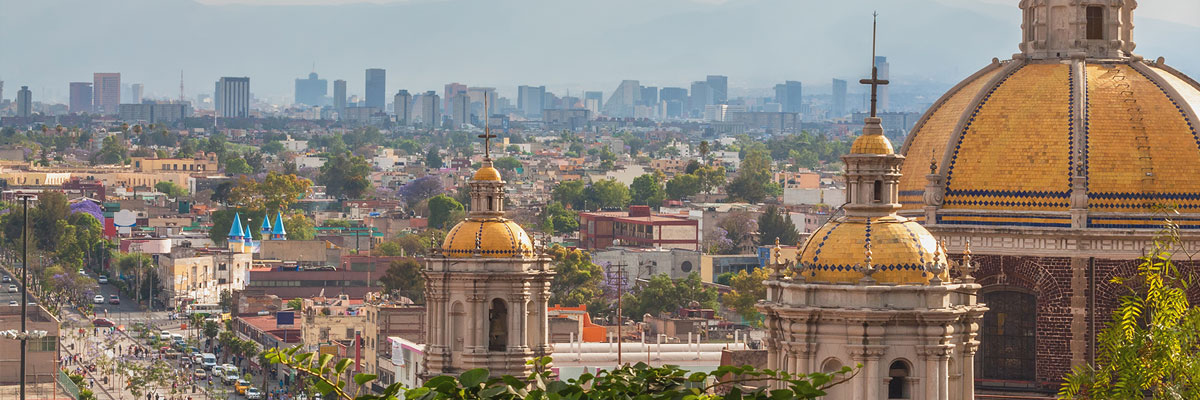 Scenic view at Basilica of Guadalupe with Mexico city skyline.