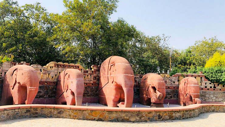 Five elephant statues in The Garden of Five Senses in New Delhi, India. 