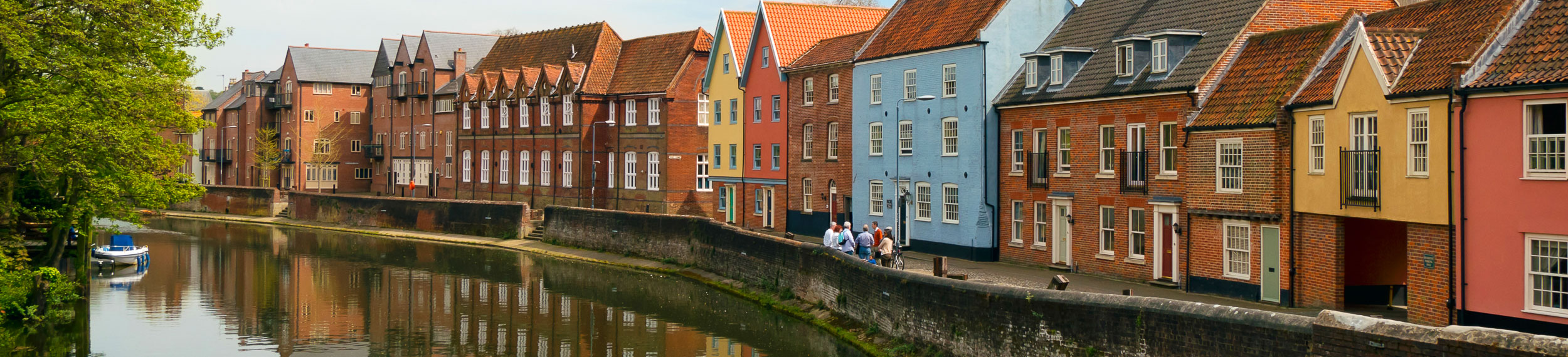 Row houses along the River Wensum in the old town of Norwich, Norfolk, England, UK