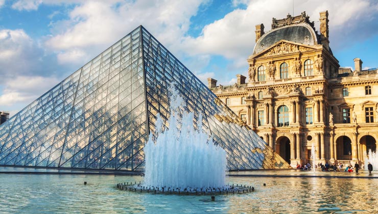 The The Louvre with the glass pyramid and fountain. 