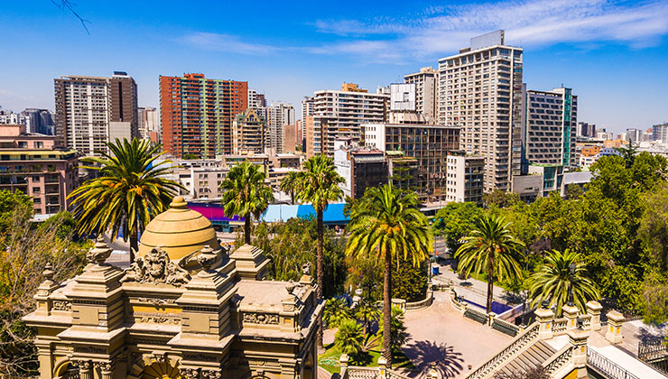 Urban park with palm trees and urban buildings in Cerro Santa Lucia, Santiago, Chile.