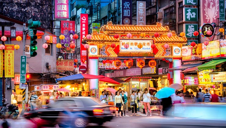 Colorful lights of Raohe Street Night Market in Taipei, Taiwan. 