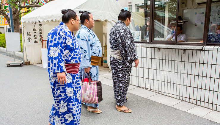 Three athletes arrive for Sumo wrestling in Tokyo 