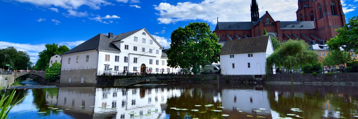 View of Uppsala Cathedral and buildings near the river in Uppsala Sweden.