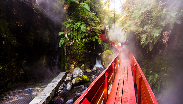 A red walkway at Termas Geometricas in Los Ríos Region, Chile. 