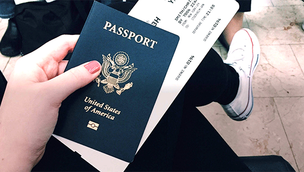 Close up of an airplane ticket and passport