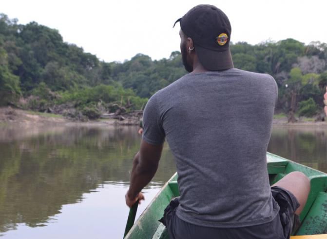 Kaël Lopes from UC Berkeley on a boat in the Amazon.
