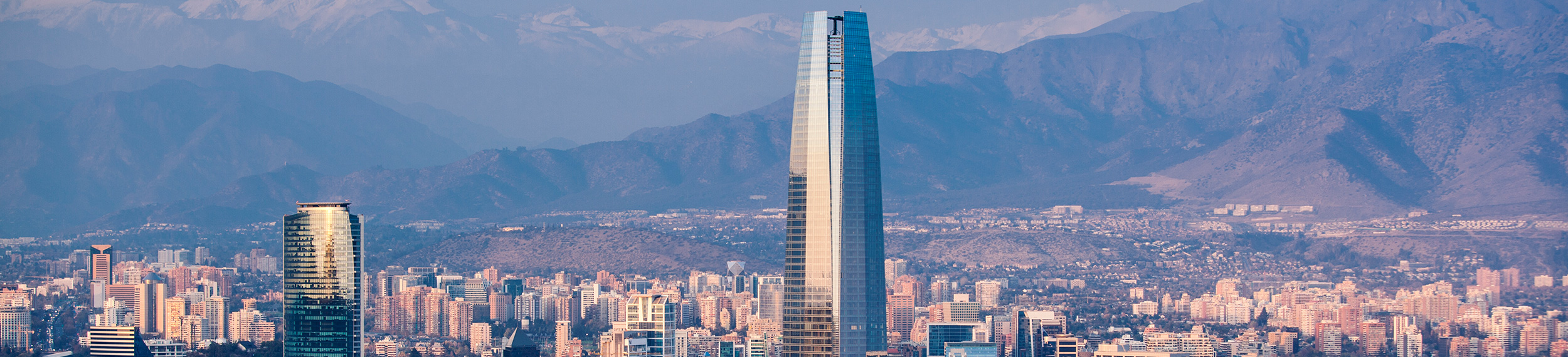 Cityscape view of Santiago financial district with mountains in distance, Chile