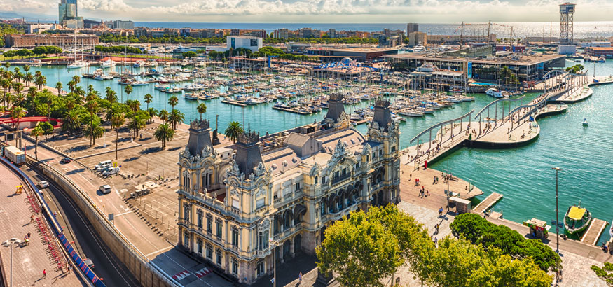 Aerial view of the Port Authority- Admiral Historic Authority building with the Port Vell harbor in the background in Barcelona, Spain.