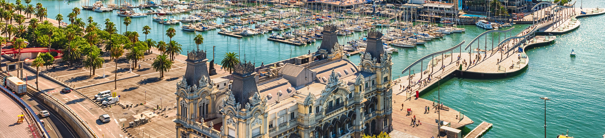 Aerial view of the Port Authority- Admiral Historic Authority building with the Port Vell harbor in the background in Barcelona, Spain.