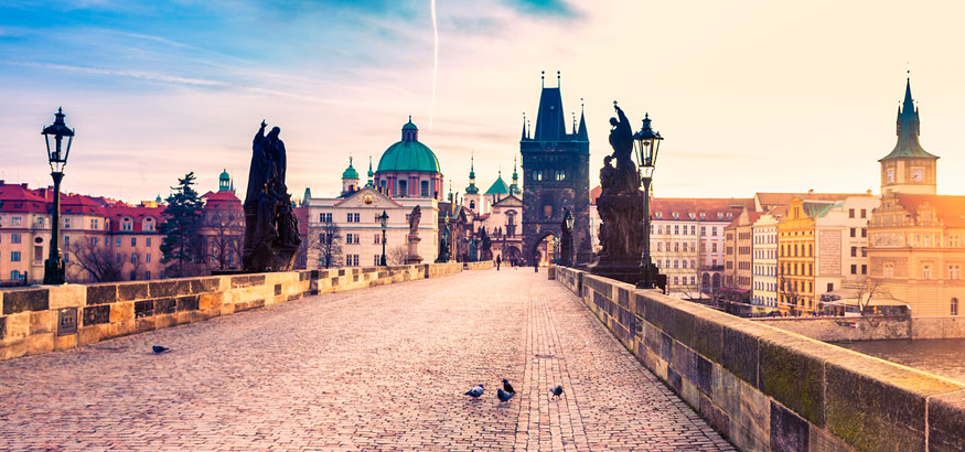 View of Charles Bridge and city skyline in Prague, Czech Republic.